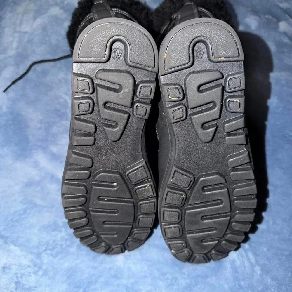 Black lace up winter boots with fur trim. Size: US 9